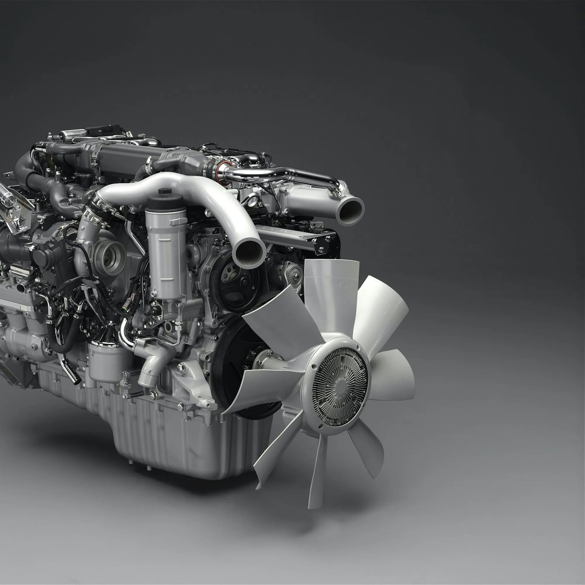 Diesel engine with turbocharger shown on a gray background